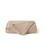 PureWoven™ 100% cotton 8-layer gauze blanket, beige, diamond quilted, floral tag.