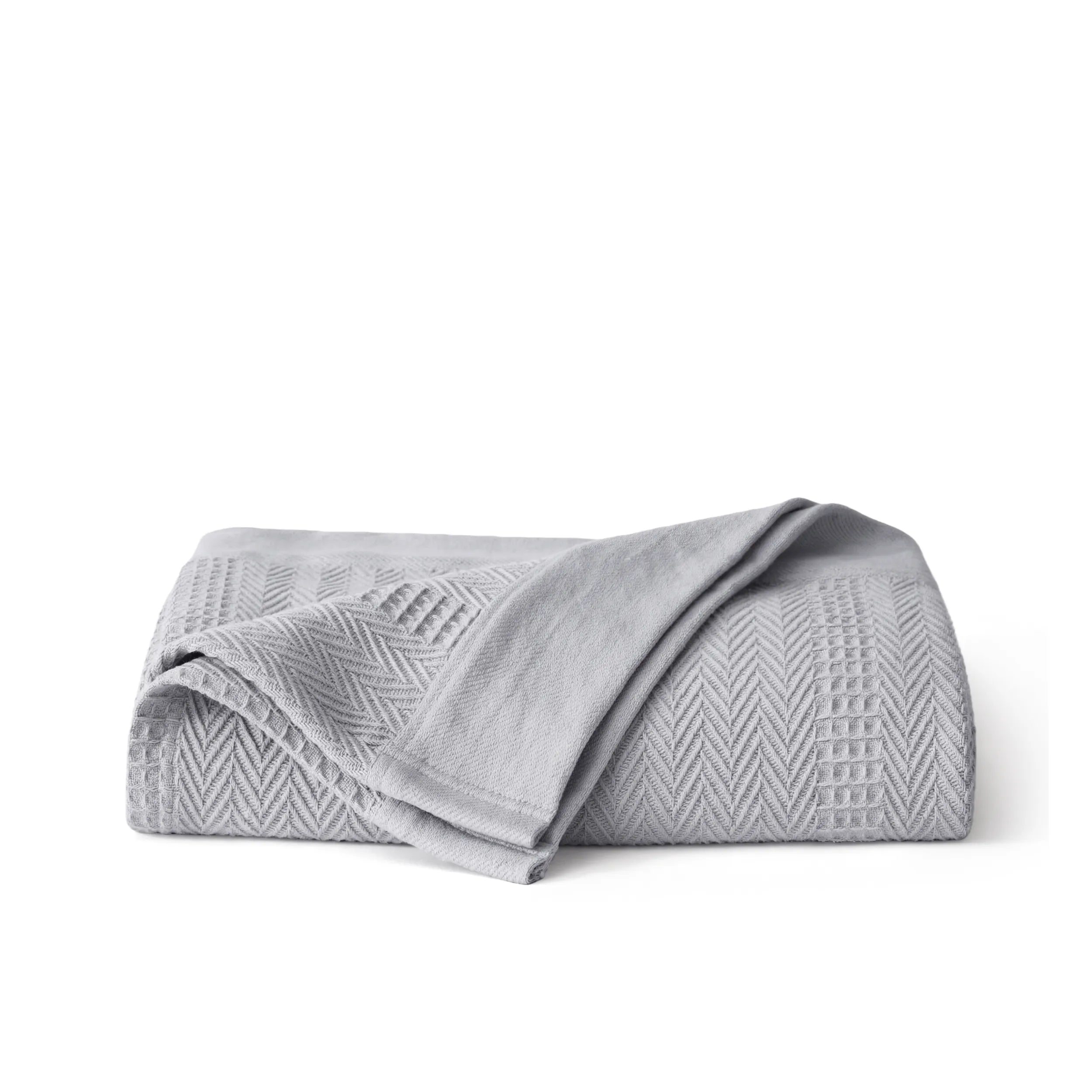 PureWoven grey organic cotton blanket with waffle and herringbone texture