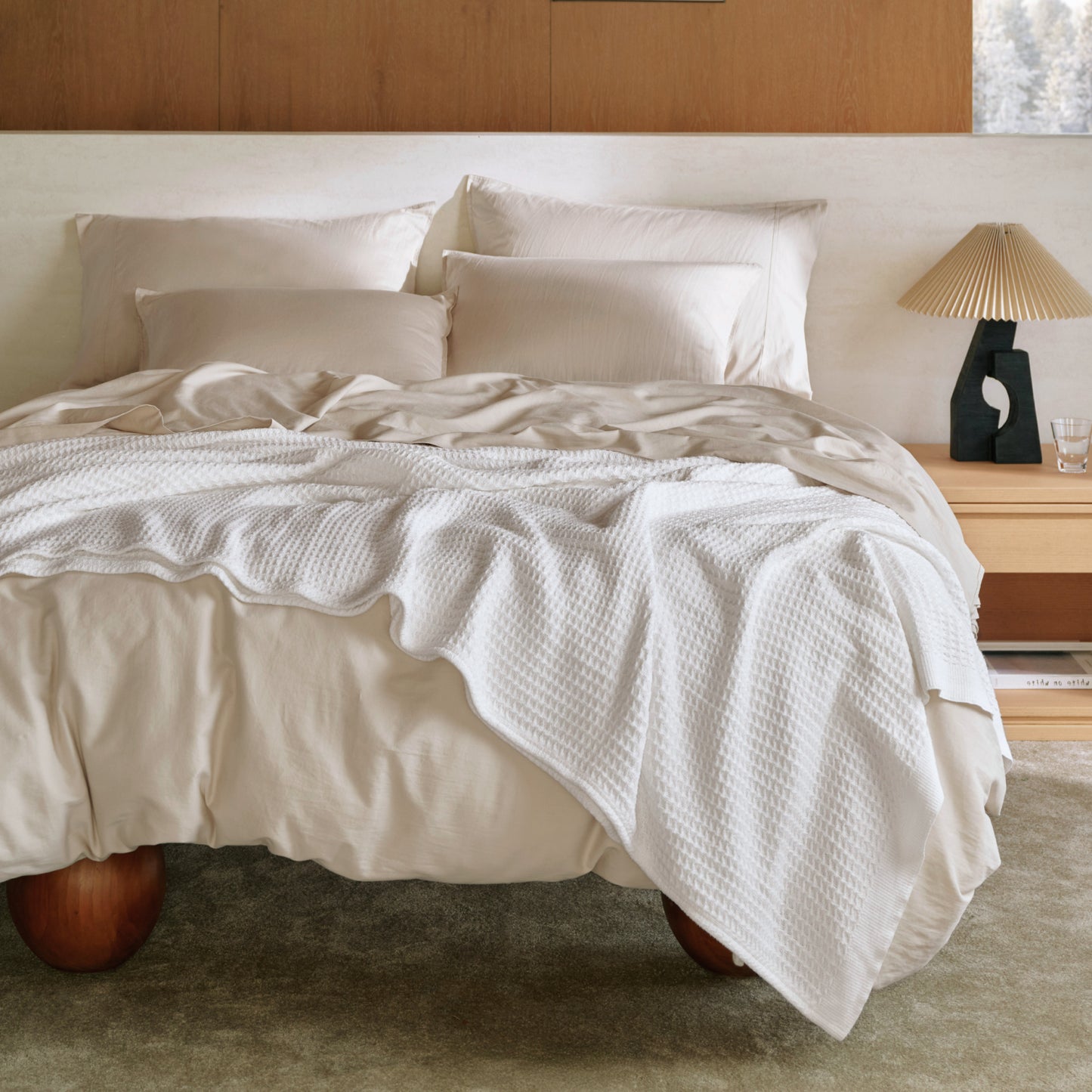 Organic Cotton Waffle Serenity Bundle: White waffle blanket on neutral organic cotton bedding.