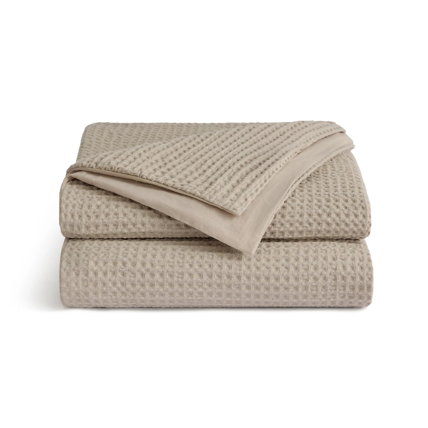 PureWoven™ beige 100% cotton waffle weave duvet cover, folded.