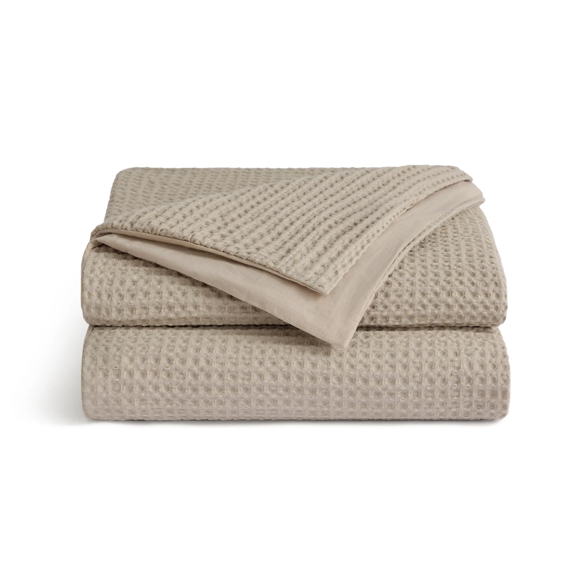 PureWoven™ beige 100% cotton waffle weave duvet cover, folded.