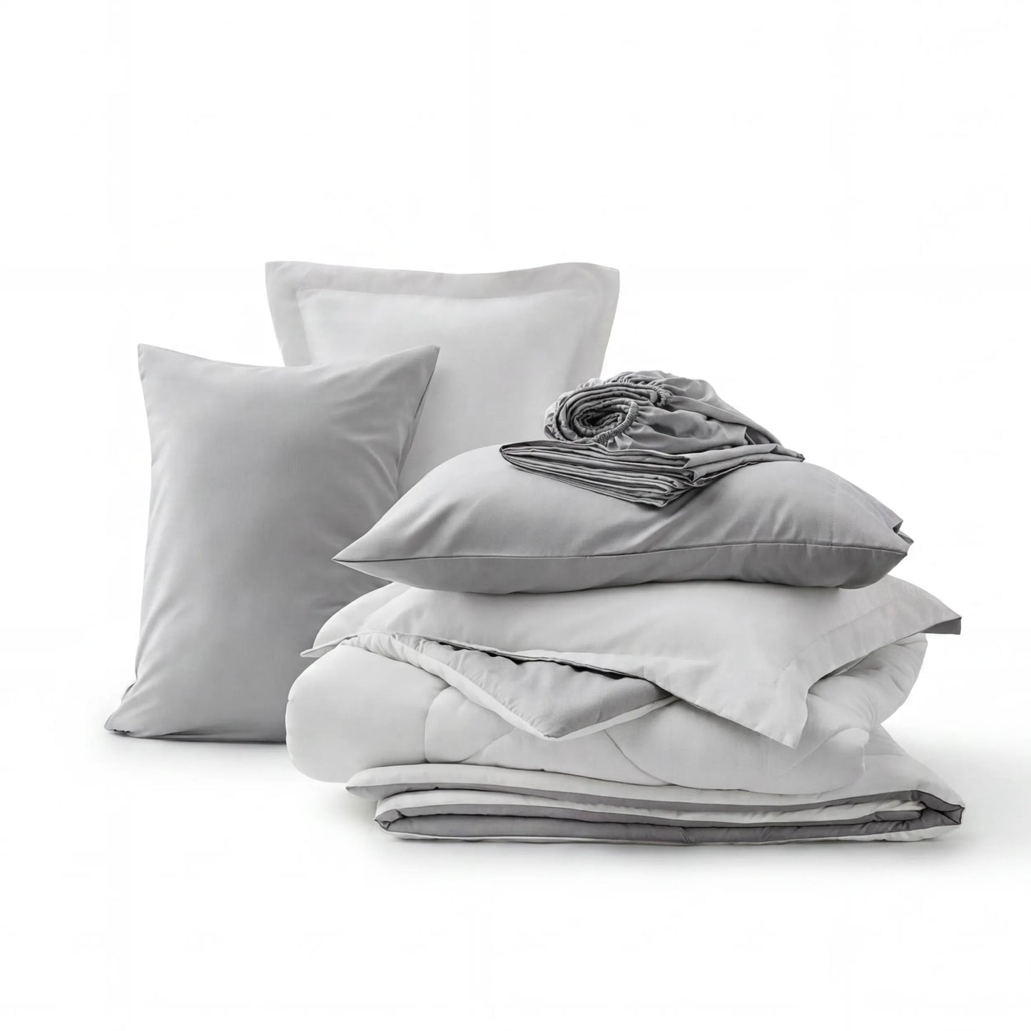 Gray and white reversible bed-in-a-bag set with quilted comforter, pillow shams, and fitted sheet.