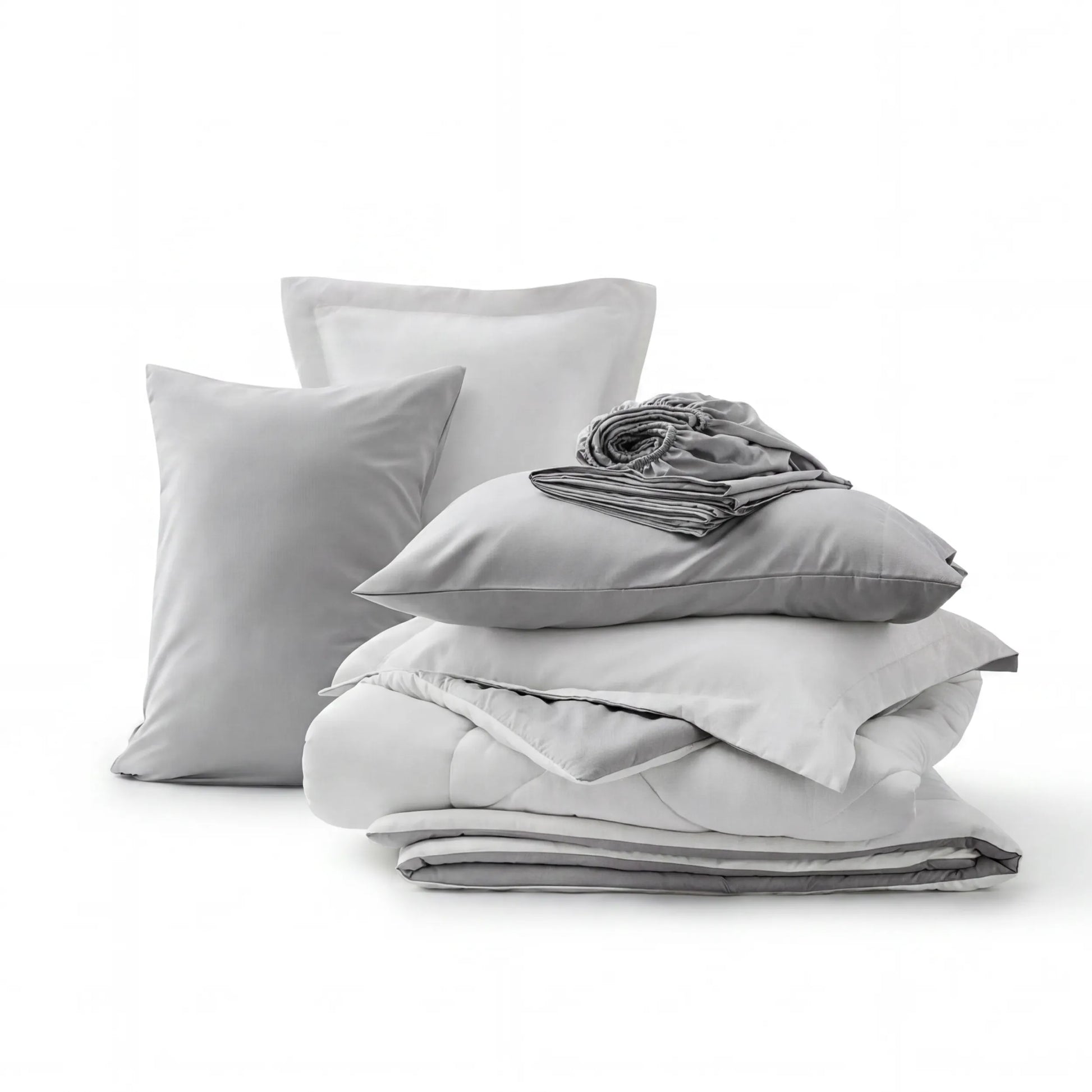 Gray and white reversible bed-in-a-bag set with quilted comforter, pillow shams, and fitted sheet.