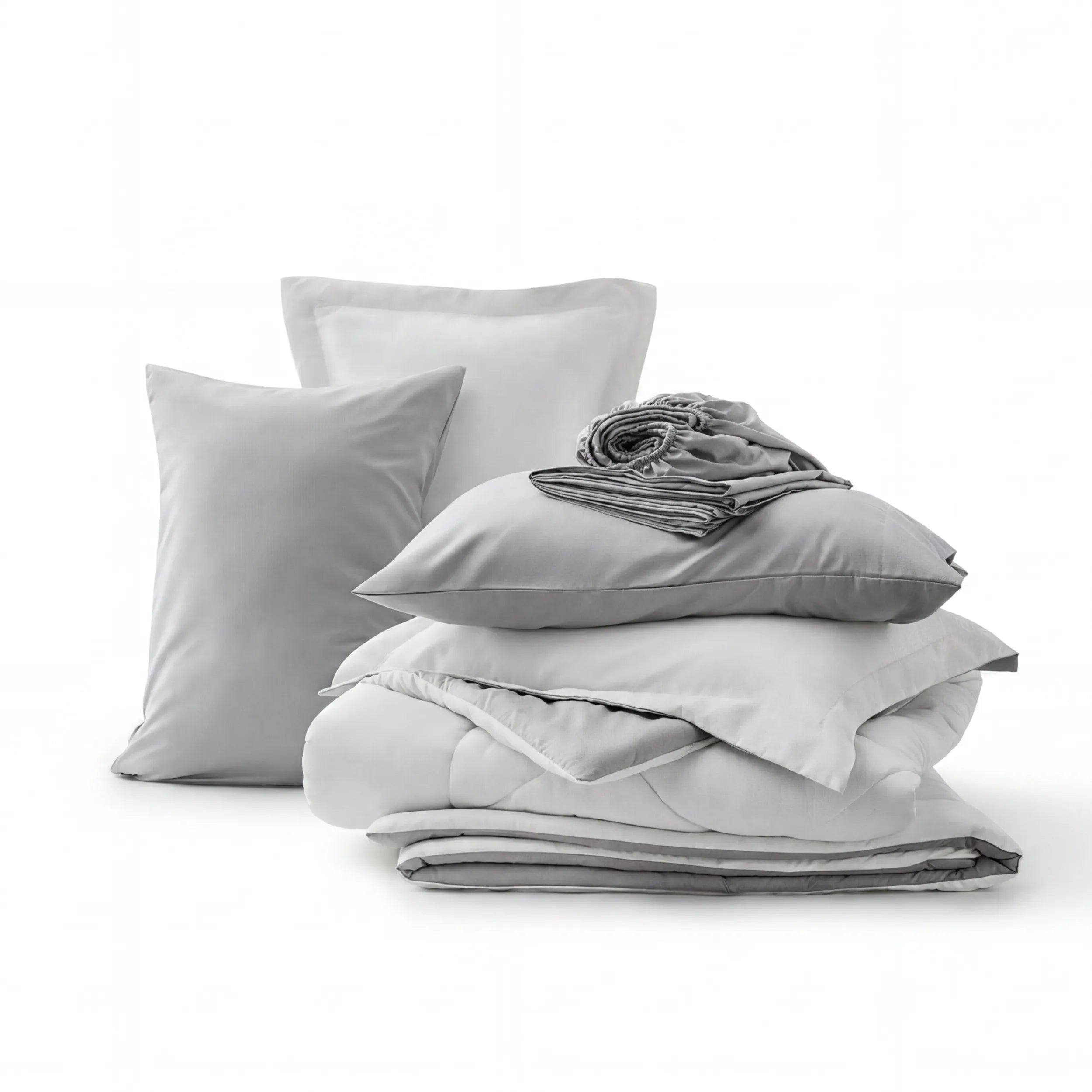 Gray and white reversible bed-in-a-bag set with quilted comforter, pillow shams, and fitted sheet.