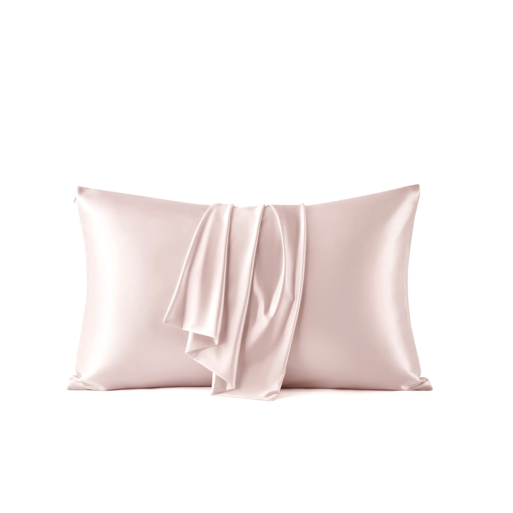 Blush Beauty Sleep pillowcase with soft draped folds, cooling nylon-spandex.