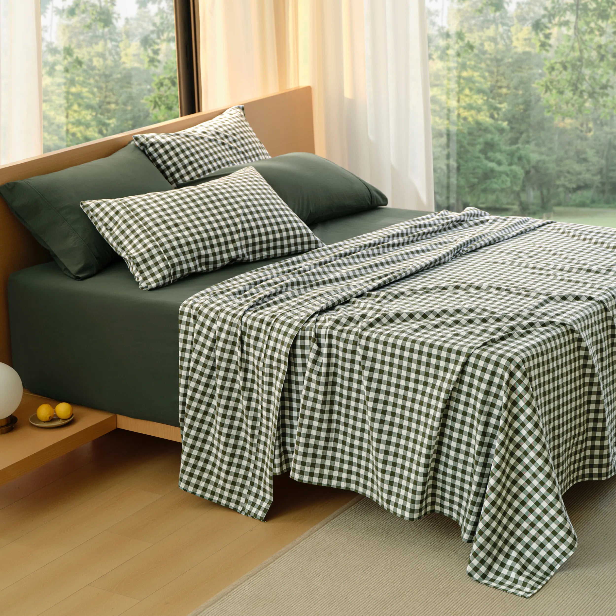 PureWoven™ 6-piece dark green washed cotton sheet set with gingham pillowcases.