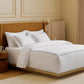 Elegant white PureWoven Giza Egyptian Cotton duvet cover set with double blue line embroidery.