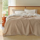 Beige PureWoven 100% cotton 8-layer gauze blanket with diamond pattern.