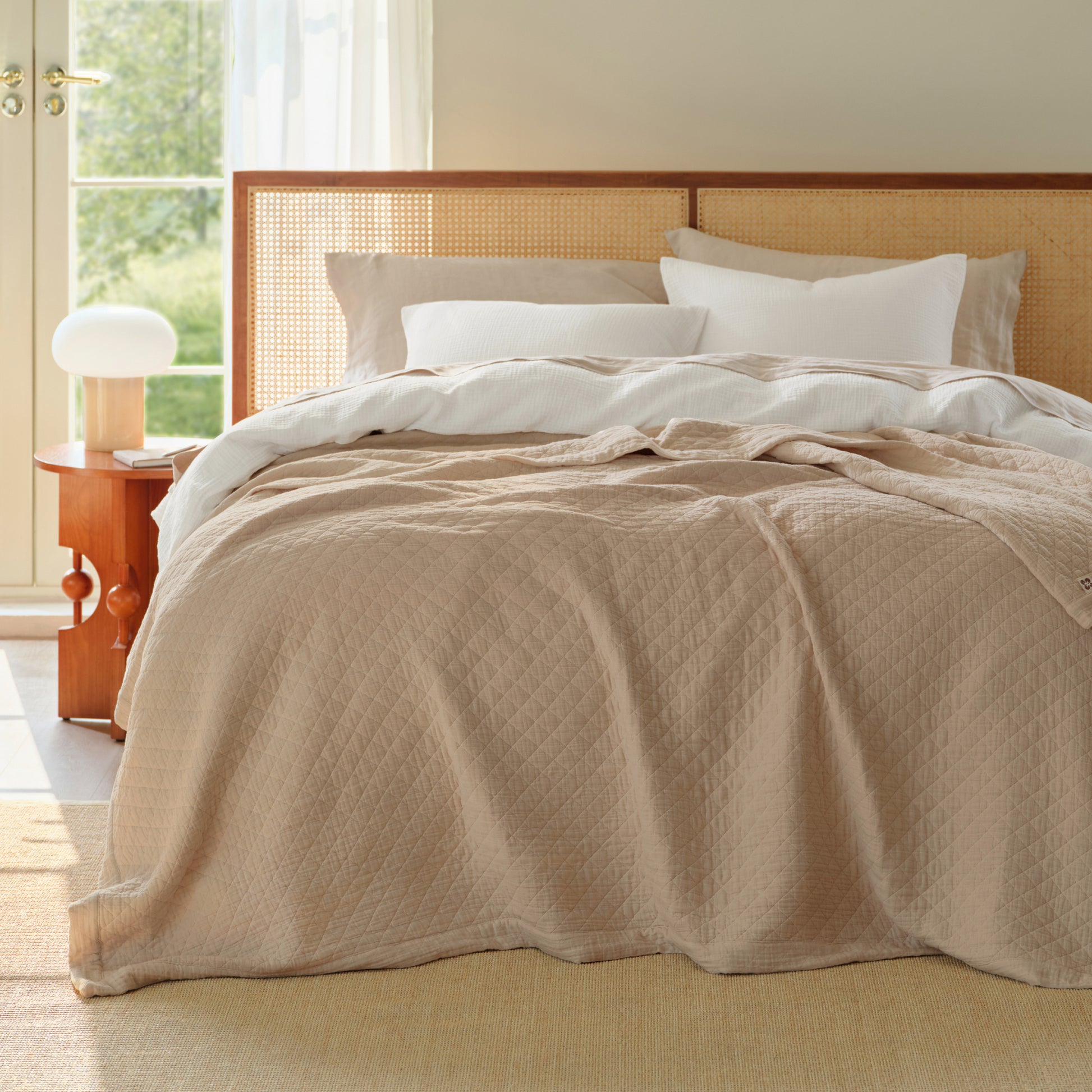 Beige PureWoven 100% cotton 8-layer gauze blanket with diamond pattern.