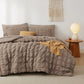 Cozy taupe seersucker bed-in-a-bag set featuring textured plaid comforter and pillows.