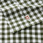 PureWoven green gingham washed cotton sheet set fabric, close-up with tag.