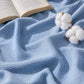 GentleSoft blue herringbone woven 100% cotton blanket with cotton bolls.