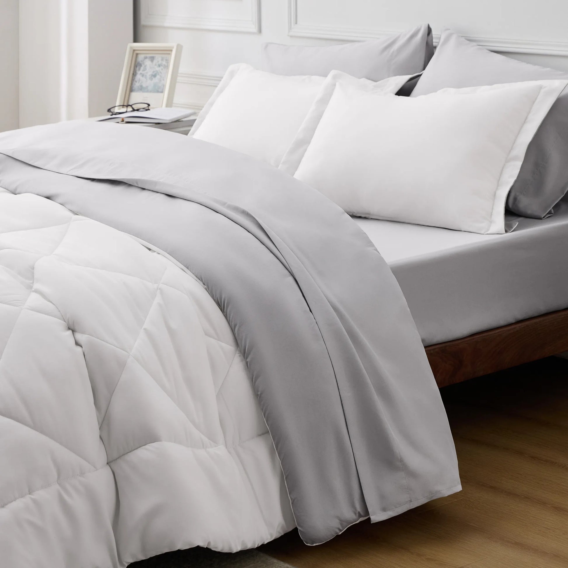 Reversible grey and white quilted microfiber comforter and bedding set