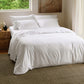 White PureWoven™ Serene Blend bedding bundle featuring soft bamboo-cotton blend for smart warmth.