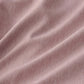 Cationic dyed polyester comforter fabric, soft pink with dual-tone texture.
