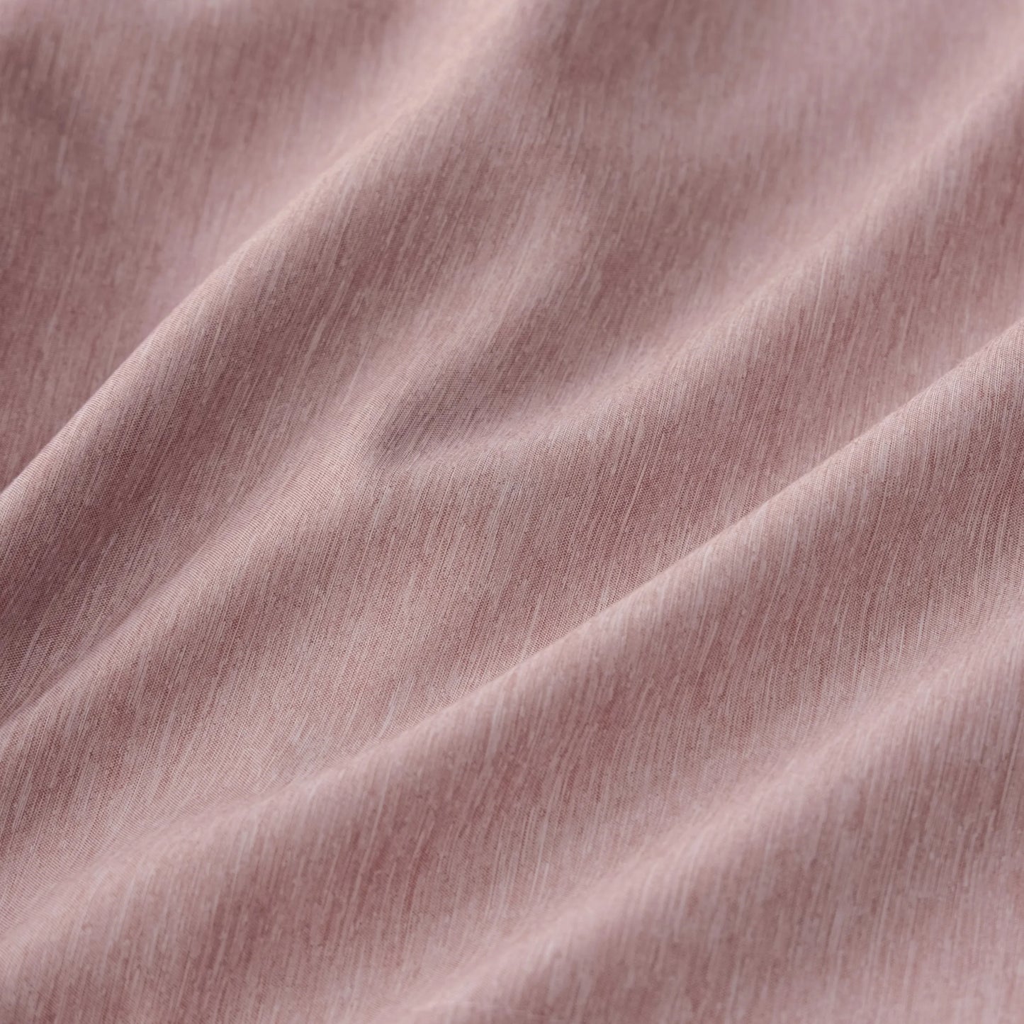 Cationic dyed polyester comforter fabric, soft pink with dual-tone texture.