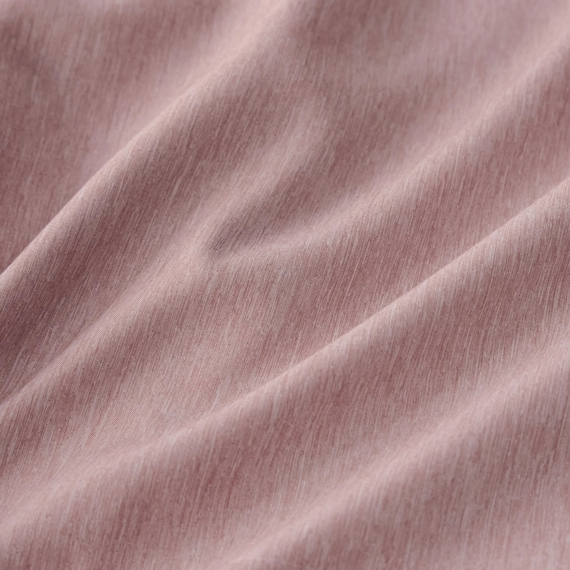 Cationic dyed polyester comforter fabric, soft pink with dual-tone texture.