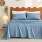 Cotton-like blue and white thin striped sheet set with pillowcases on a bed.