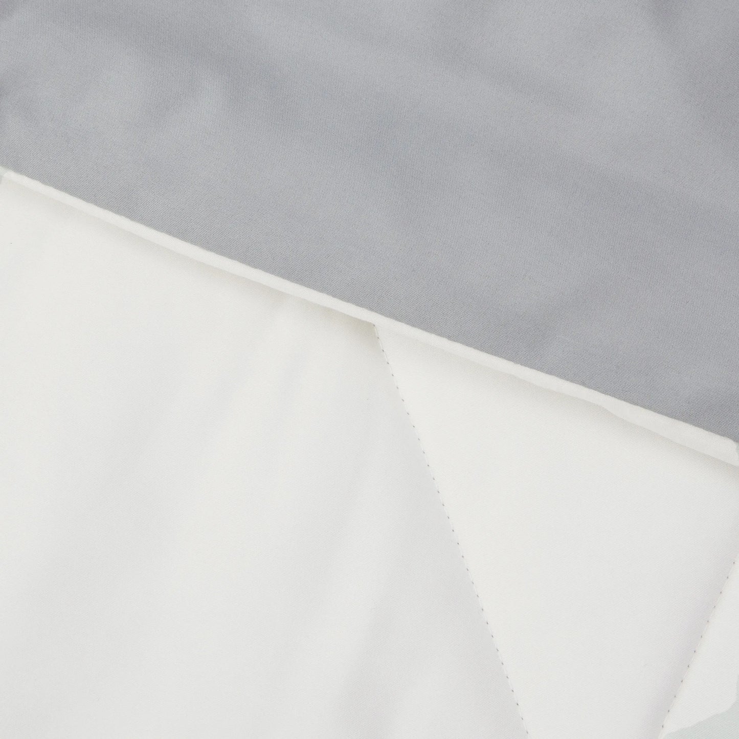 Grey/white reversible microfiber bed-in-a-bag fabric with diamond quilting.