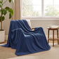 GentleSoft navy herringbone woven 100% cotton blanket on chair.