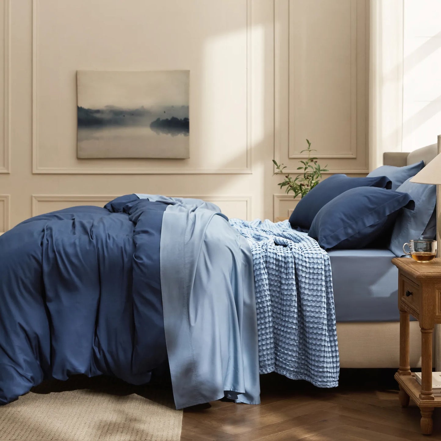 Blue rayon derived from bamboo bedding bundle with textured waffle blanket.