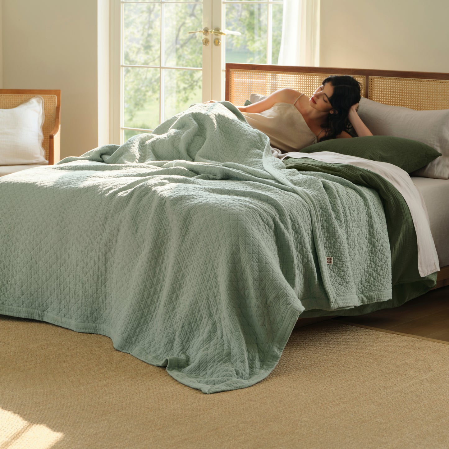 PureWoven™ light green 8-layer cotton gauze blanket with diamond quilt pattern.