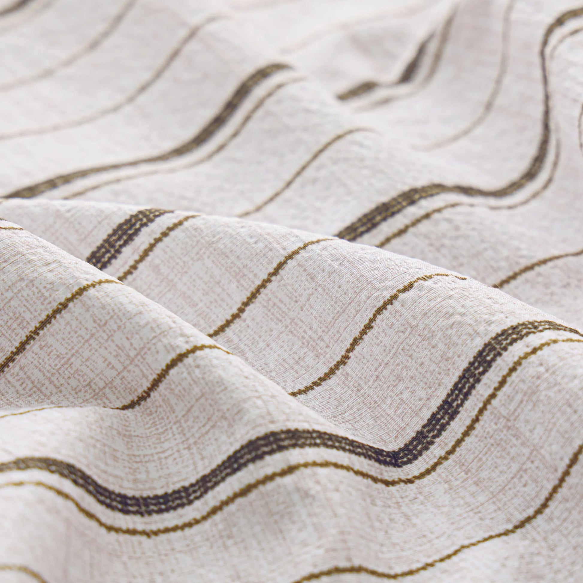 Light beige cotton-like striped sheet fabric with wavy dark stripes and textured weave.