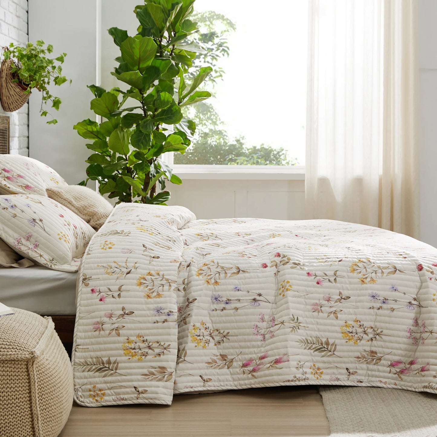 Botanical Quilt Set: Cream polyester with soft floral pattern and quilting.