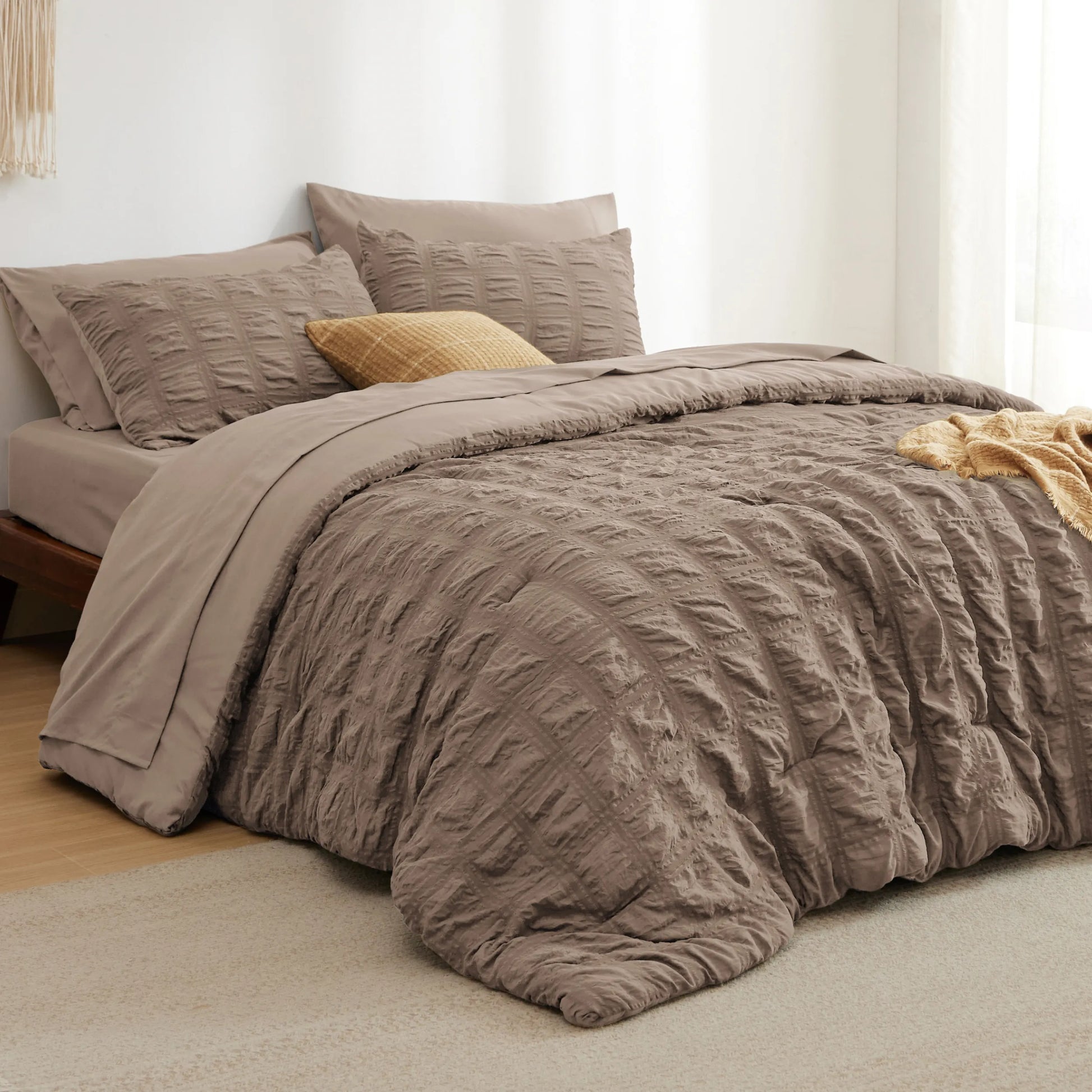 Brown seersucker bed-in-a-bag set featuring textured comforter and pillow shams.