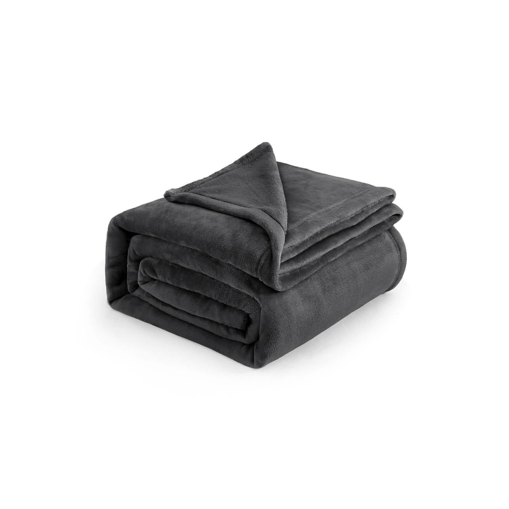 Dark grey 300gsm flannel fleece blanket, folded to showcase plush texture and warmth.