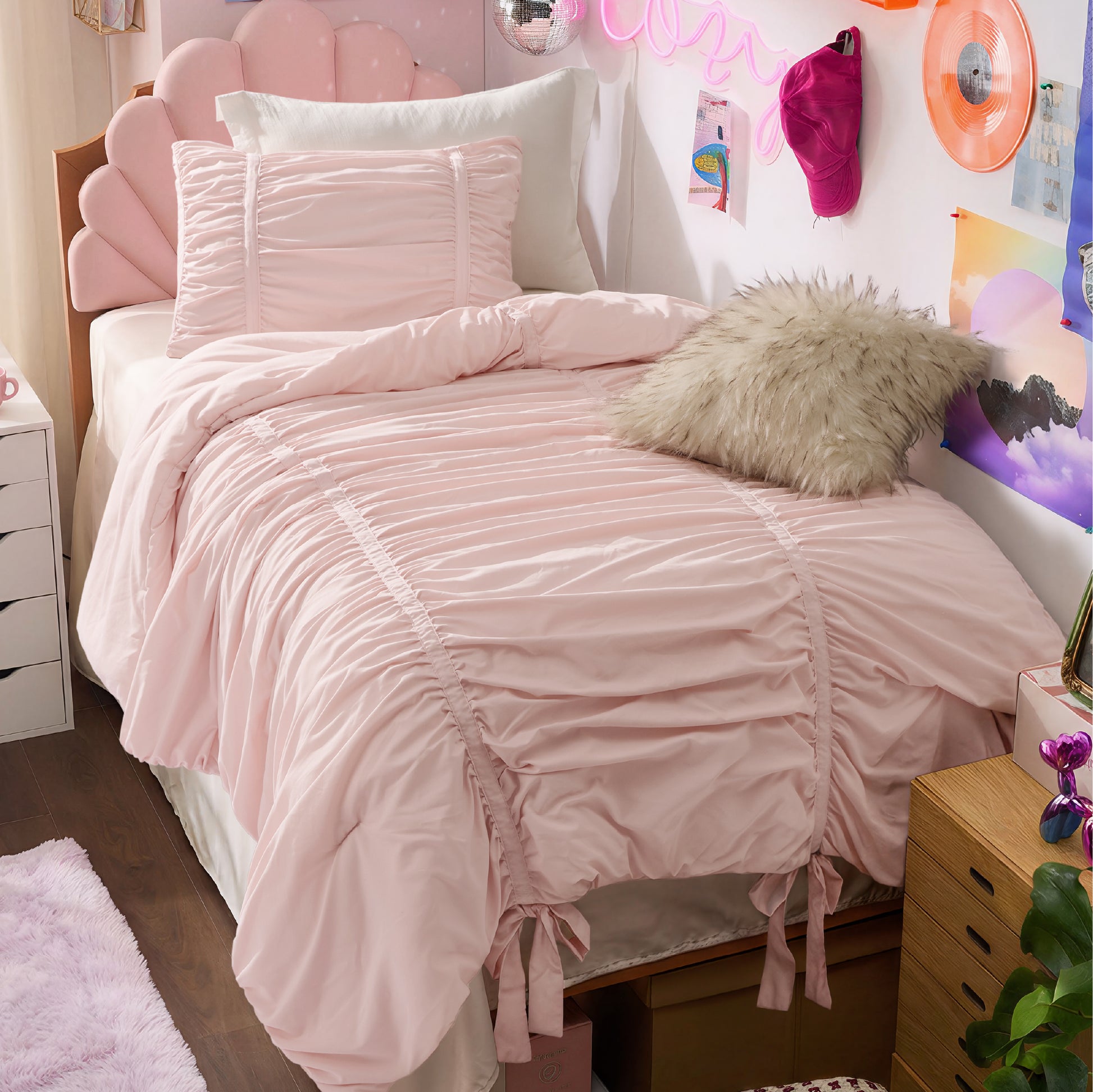 Ruched Bow Comforter Set in soft pink with decorative bow ties and scalloped headboard.