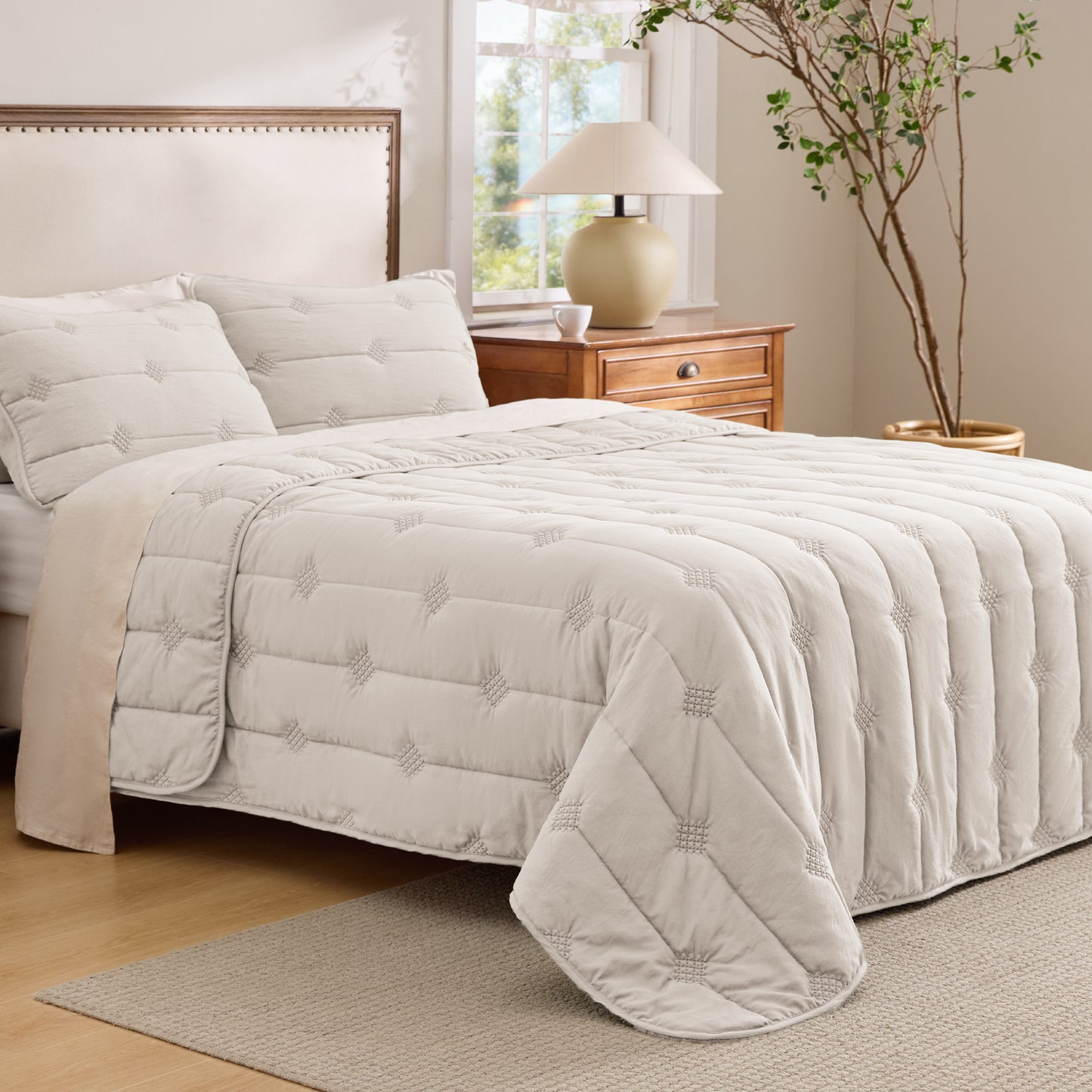 Cream prewashed diamond quilt set with vintage dot stitching and matching shams.