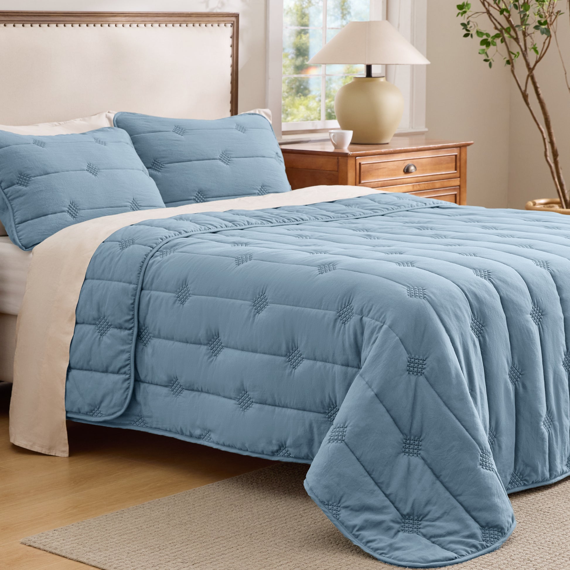 Prewashed elegant blue diamond quilt set with dot stitch design.