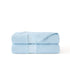 Cooloxy breathable cooling comforter in light blue, folded, showcasing soft texture and perforated cooling zones.