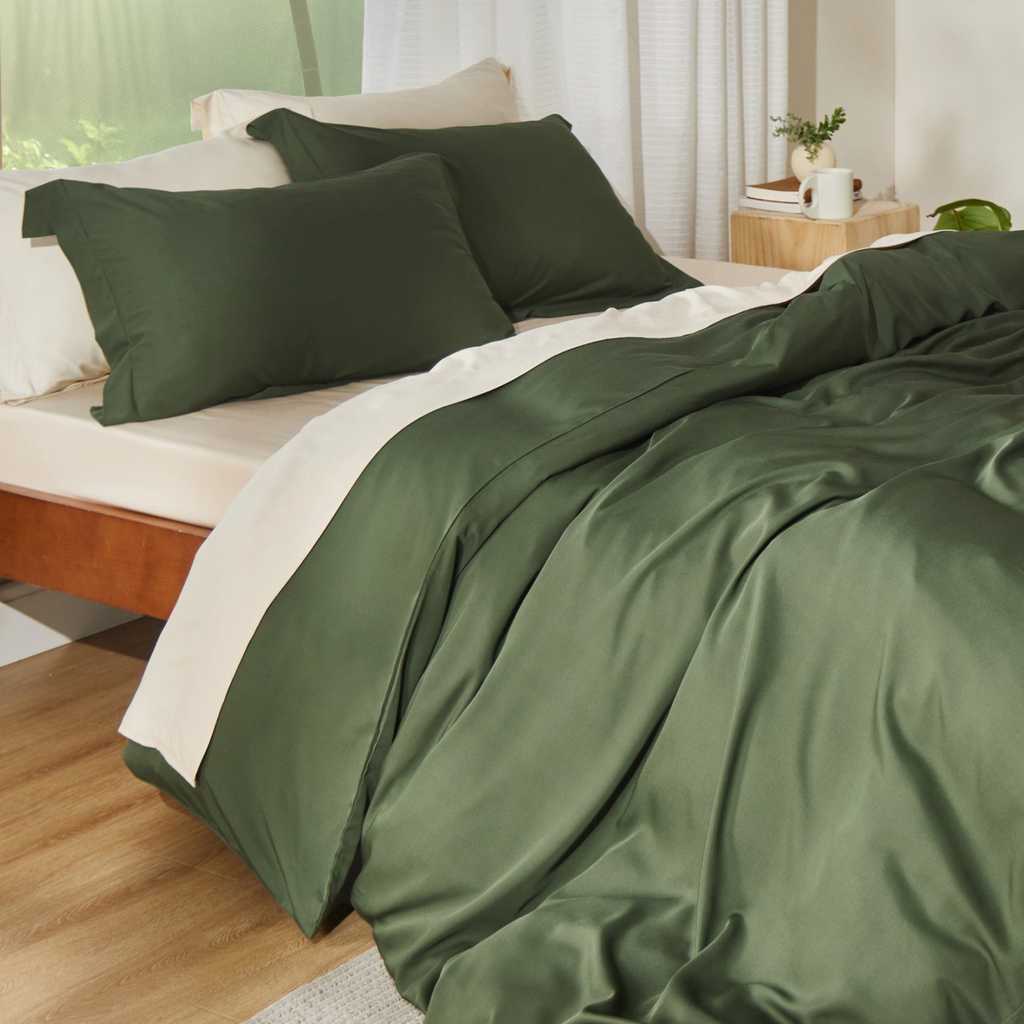 Rayon derived from bamboo bedding bundle in deep green, featuring a duvet cover and pillow shams.