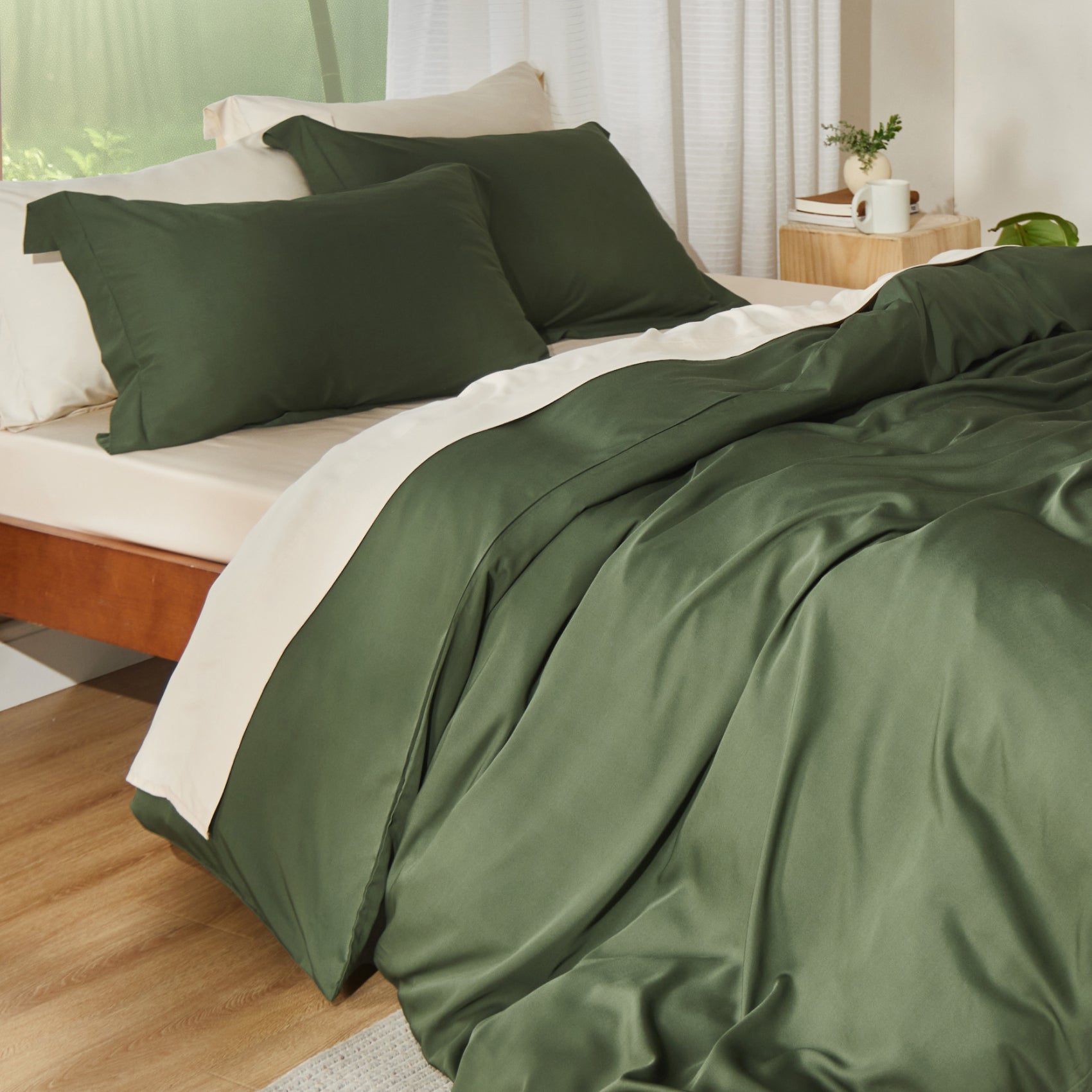 Rayon derived from bamboo bedding bundle in deep green, featuring a duvet cover and pillow shams.