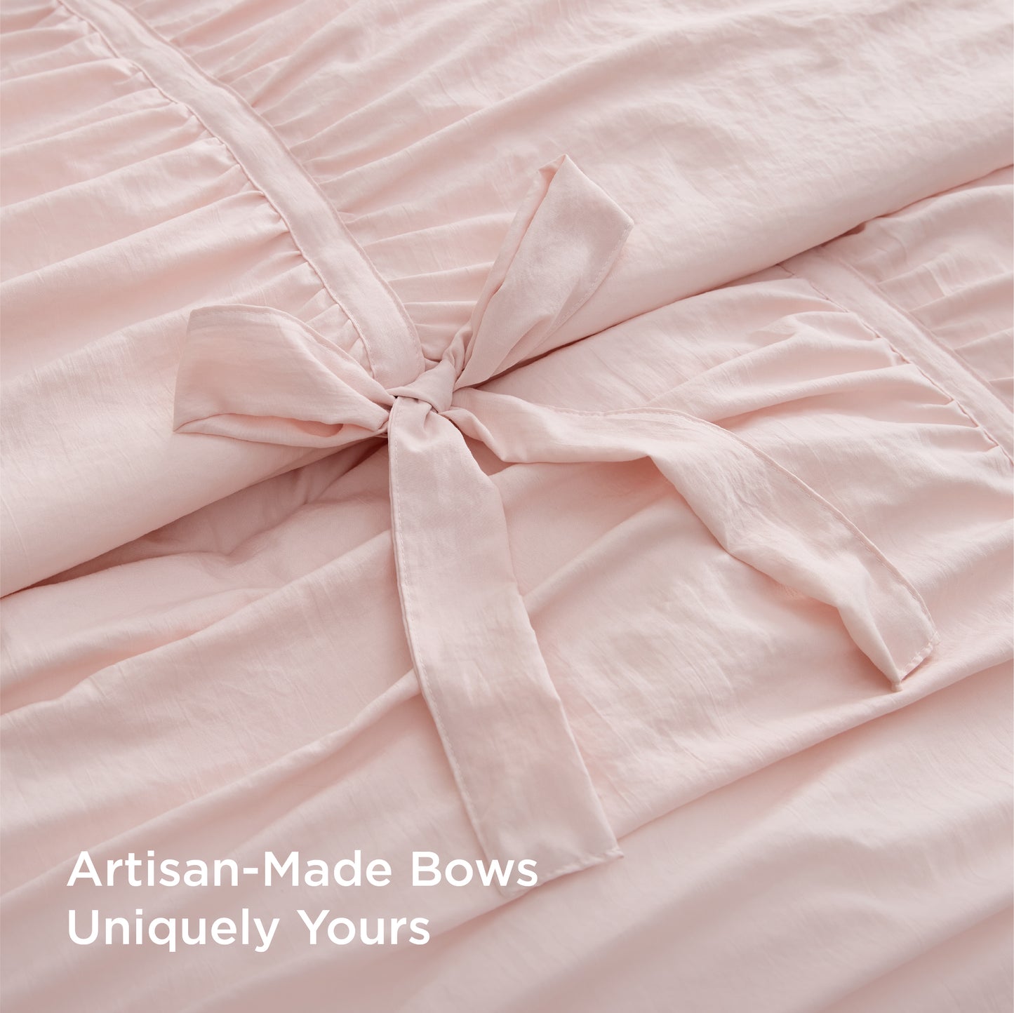 Pink ruched comforter set with handcrafted artisan bows.
