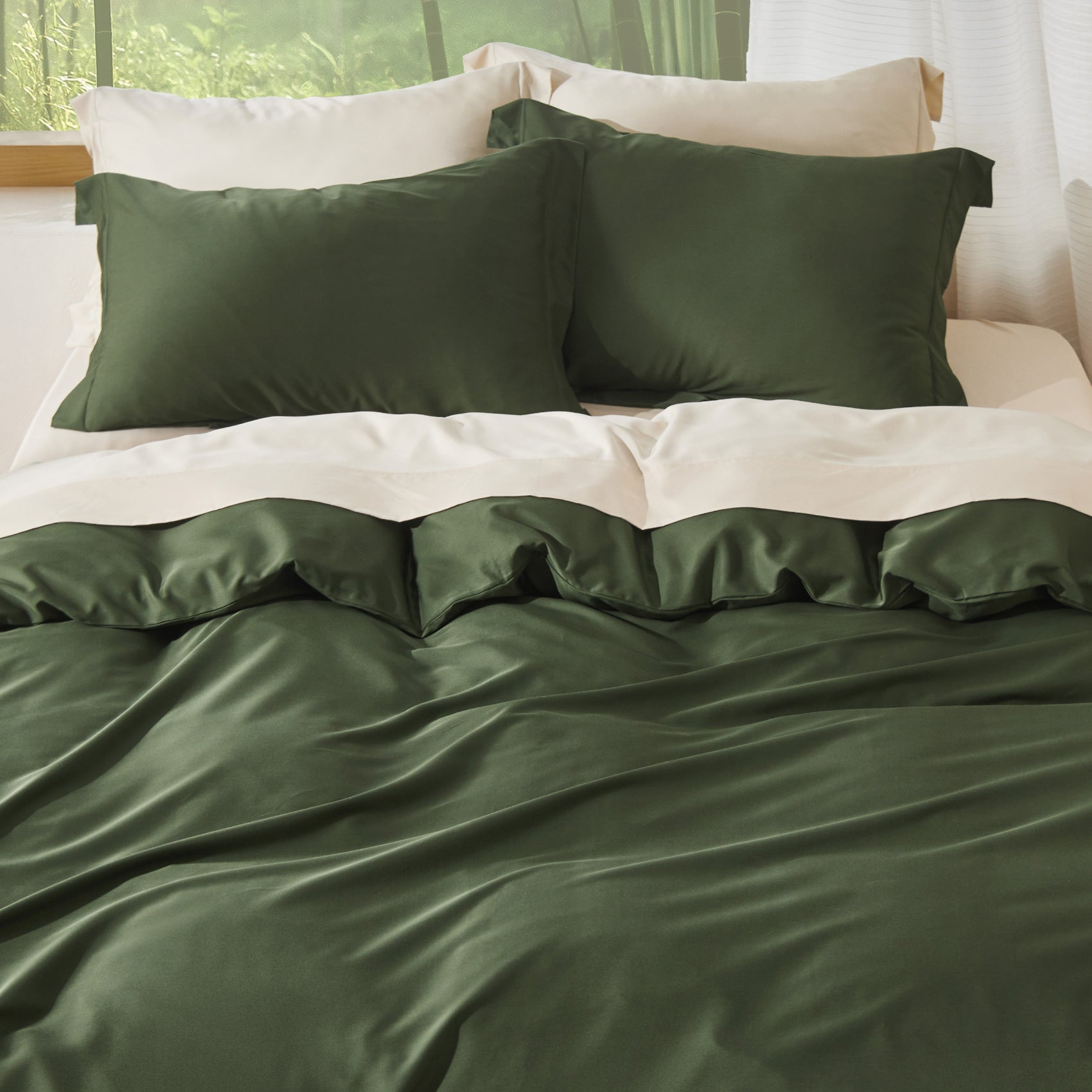 Green rayon derived from bamboo bedding set bundle with silky pillows.