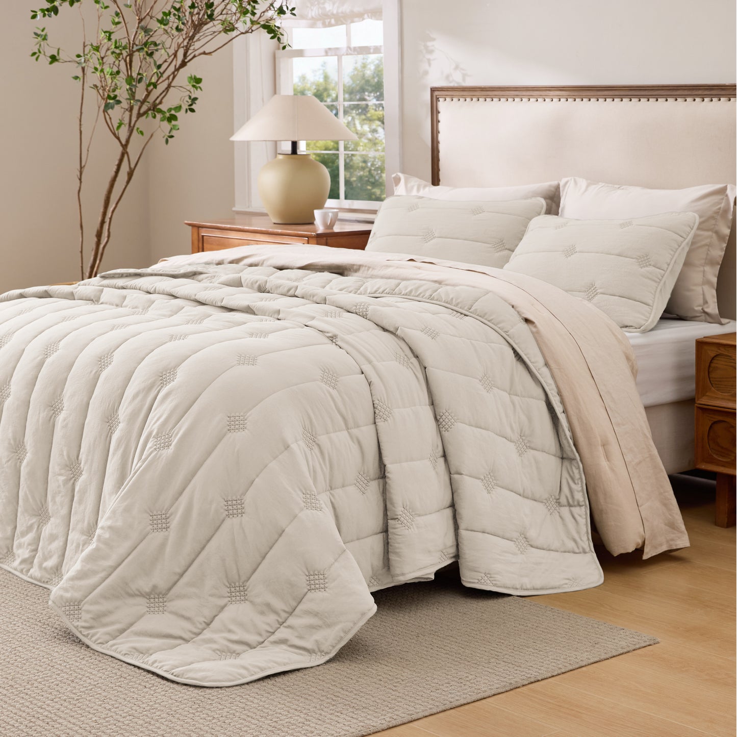 Prewashed diamond quilt set in beige polyester with vintage dot stitching.