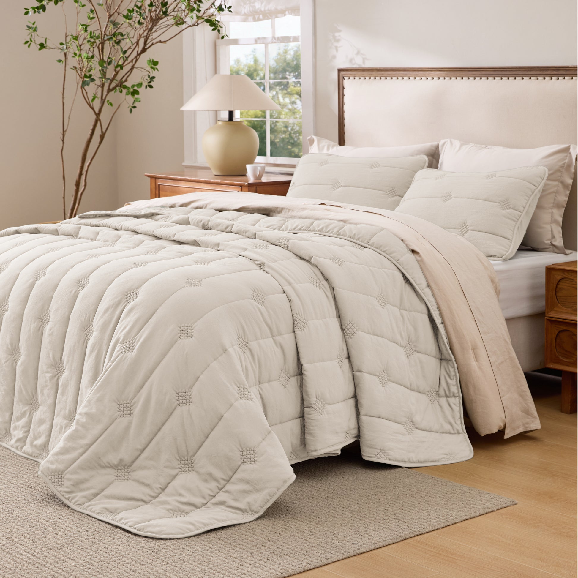 Prewashed diamond quilt set in beige polyester with vintage dot stitching.