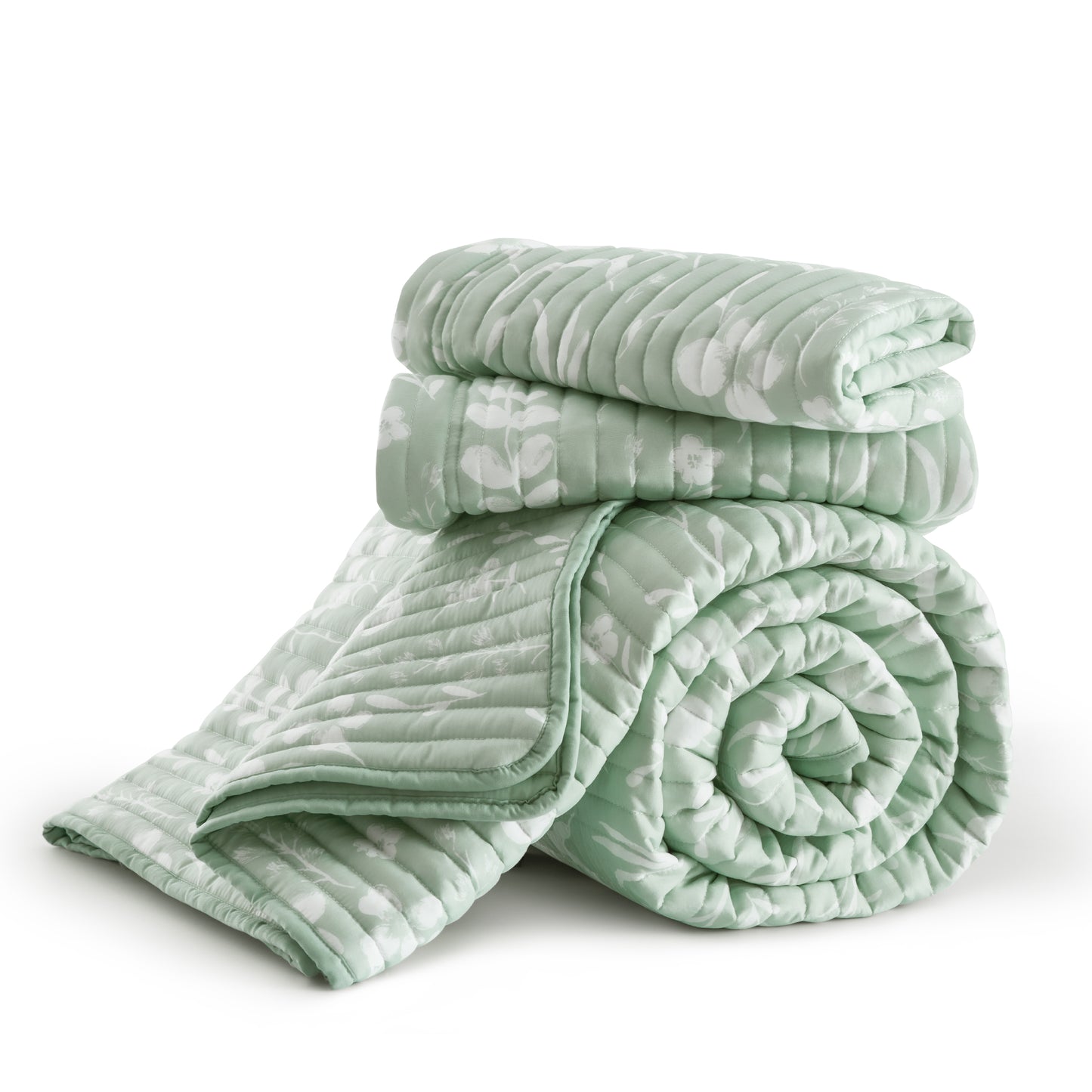 Light green botanical quilt set with white floral print and channel quilting texture.