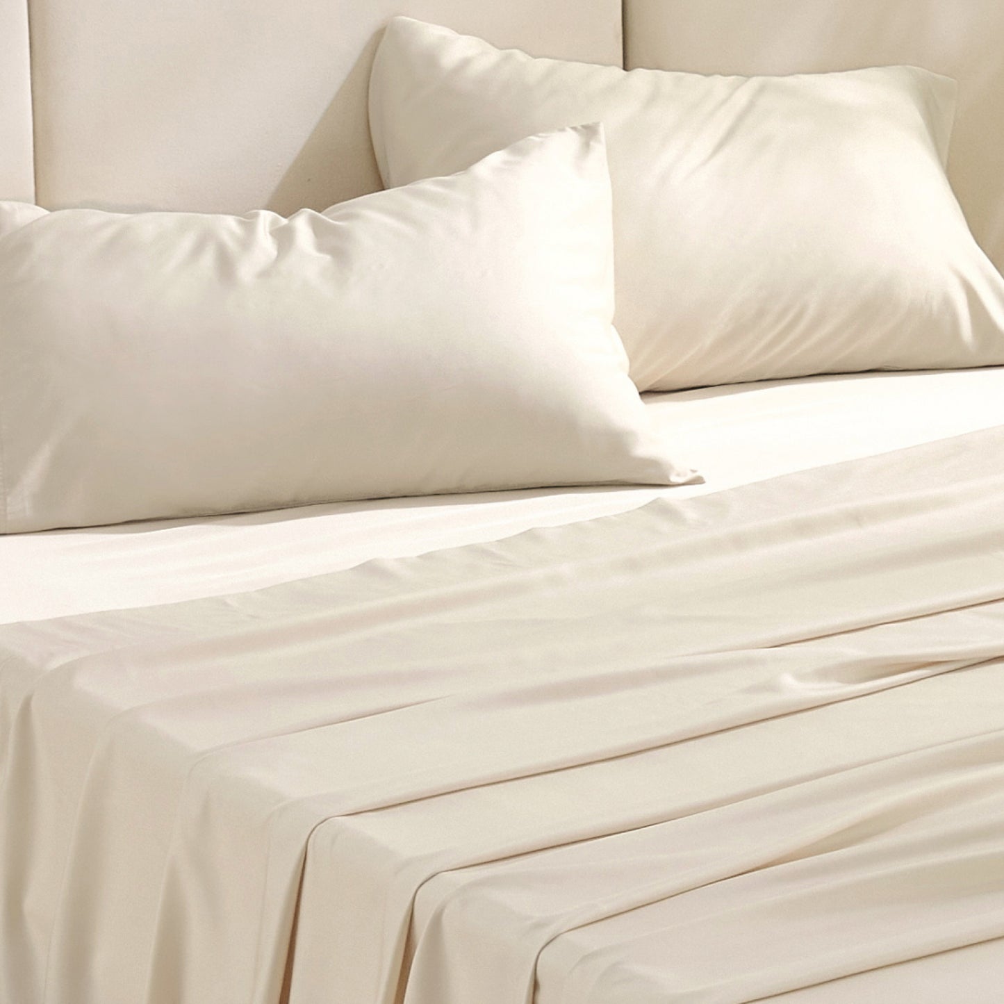 Rayon derived from bamboo bedding bundle in cream, soft texture.