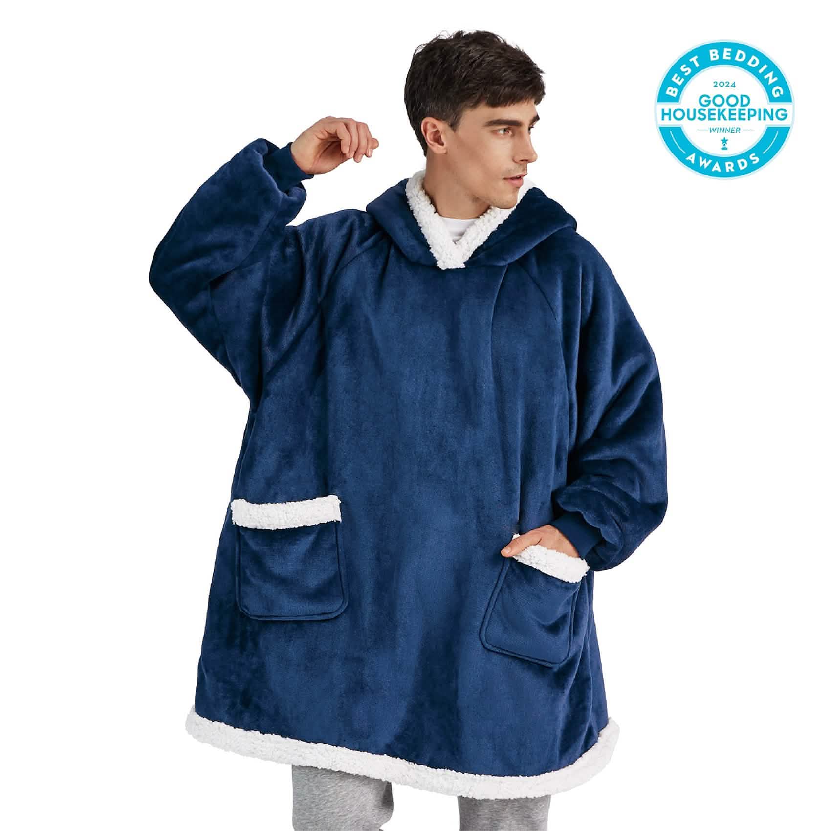 Navy blue sherpa fleece wearable blanket with white trim, hood, and pockets. Good Housekeeping award winner.
