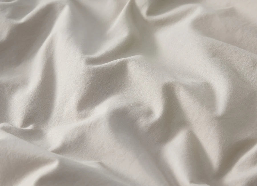 Close-up of white fabric with folds 