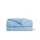 Folded light blue Nylon Comforter, soft texture, quilted design, ideal for cooling.