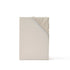 Beige cooling fitted sheet with elasticated corner and gathered fabric.